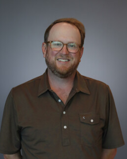 Headshot of Travis Rechenbach, a full-desk recruiter and sales professional at JMS Talent